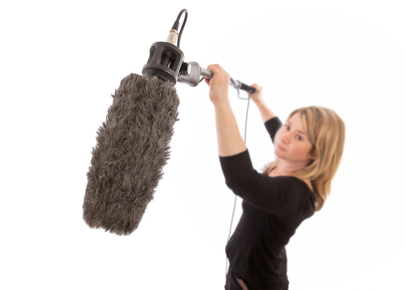 woman holding sound equipment
